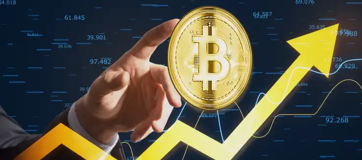 finger pointing to a bitcoin