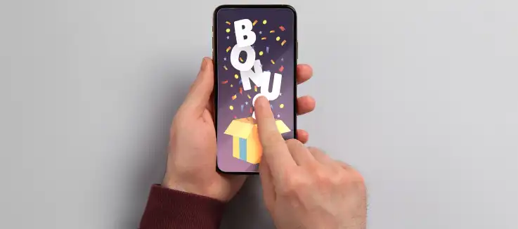 man holding a mobile phone with the word “bonus”